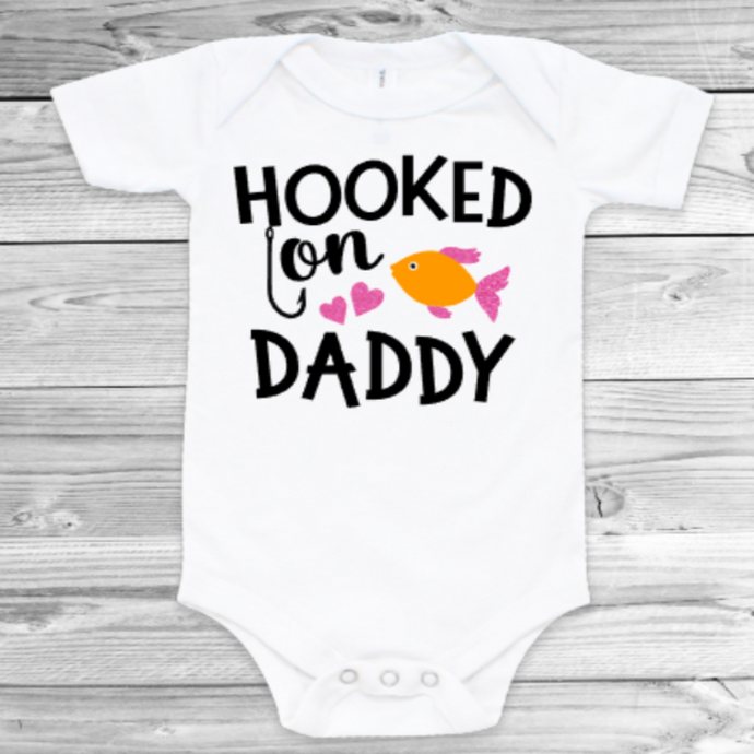 Short sleeve baby girl bodysuit. Hooked on daddy fishing theme print. 